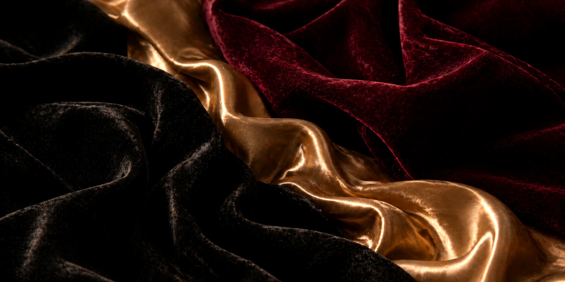 Black, champagne and burgundy velvet fabric texture